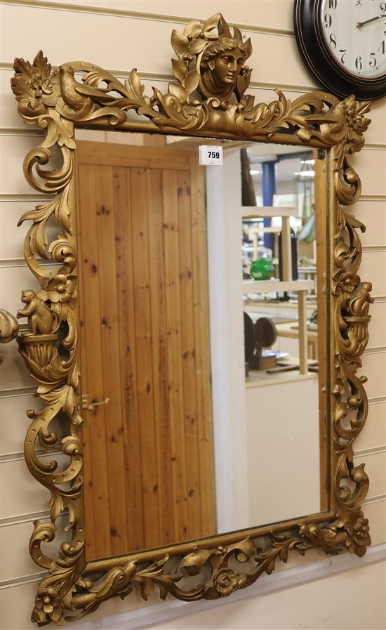 A gilt painted carved wood mirror W.69cm